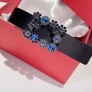 Brand new black silk belt with blue rhinestone buckle